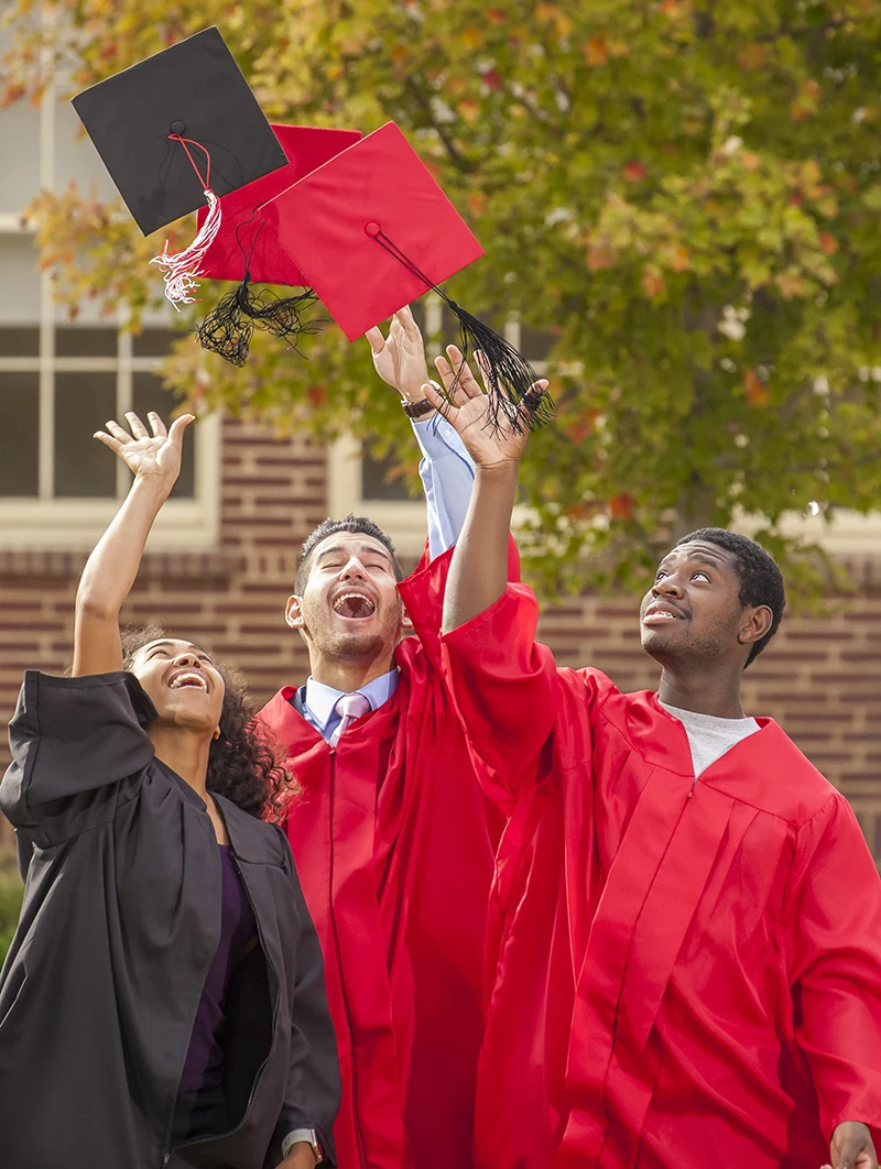 FCC Student Throwing graduation caps