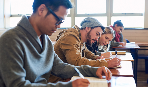 students writing in class